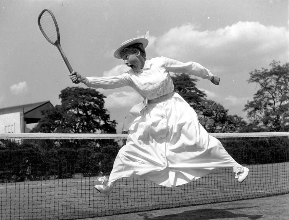 19th June 1960:  American tennis player Darlene Hard wearing a period tennis dress at a pre-Wimbledon Tennis party at the Hurlingham Club, London.  (Photo by Douglas Miller/Keystone/Getty Images)