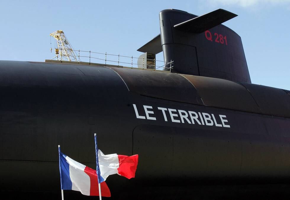 FRANCE - MARCH 21:  French flags fly during the launch of the country's latest and fourth nuclear-powered submarine, "Le Terrible," in Cherbourg, France, on Friday, March 21, 2008. President Nicolas Sarkozy affirmed at the launch France's commitment to a strategy of nuclear deterrence, saying that countries in the Middle East and Asia are developing missiles that pose a threat to Europe.  (Photo by Judith White/Bloomberg via Getty Images)
