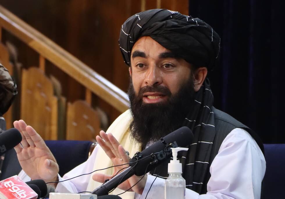 epa09418130 Zabihullah Mujahid, Taliban spokesman talks with journalists during a press conference in Kabul, Afghanistan, 17 August 2021. The new Taliban leadership that swept to power in Afghanistan has said it would not seek revenge against those who had fought against it and would protect the rights of Afghan women within the rules of Sharia law. Mujahid added the Taliban would work to avoid any return to conflict or for Afghanistan to become a hub for terrorism that would threaten other countries in the region.  EPA/STRINGER
